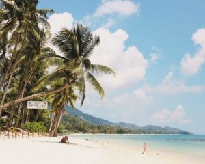 A woman and a child are enjoying on a beach