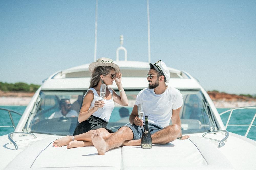 A man and woman enjoying on a yacht