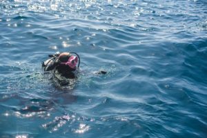 A diver in the blue sea