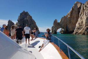 Tourists on the bow of a charter boat in Cabo San Lucas