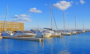 Luxury yachts docked at the harbor.