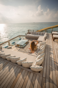 : A woman enjoying the sunset on a yacht