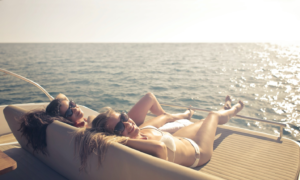 Women sunbathing on a yacht