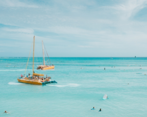 A yacht full of people sailing in the ocean